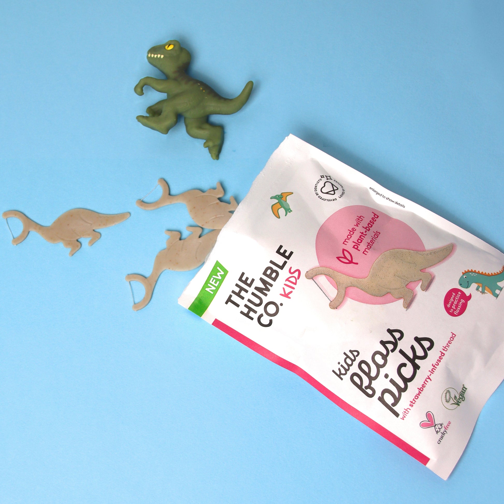 Aplicador de fio dentário com formato de dinossauro para crianças da The Humble Co.